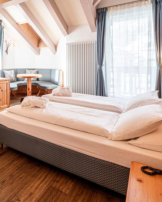 le camere dell'Hotel Soreghes in Val di Fassa